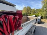 a truck that has a bunch of luggage on the back of it