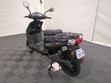 a scooter that is parked in a room