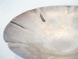 a white bowl sitting on top of a white table