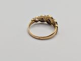 an 18k gold ring set with diamonds