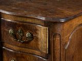 a wooden table with three drawers on top of it
