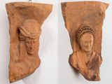two pieces of wood with carvings of a woman and a man on them
