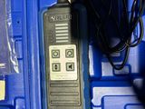 a blue case with a radio and a charger in it