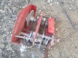 a red and silver device on the ground