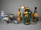 many different vases and lamps that are on the table