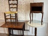 two chairs and a table in the corner of a room