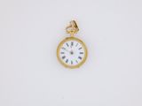 an antique gold pocket watch with roman numerals on the face