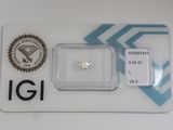 a close up of a diamond on a card on a table