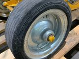 a tractor that is sitting on a pallet in a warehouse