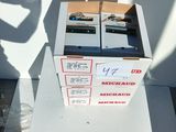 two boxes of electronic equipment sitting on top of a table
