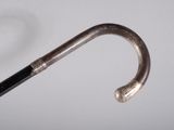 a close up of a metal handle with a black handle