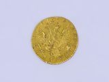 une image d'une pièce d'or sur une surface blanche