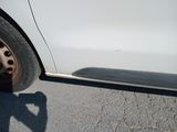a white car parked on the side of the road