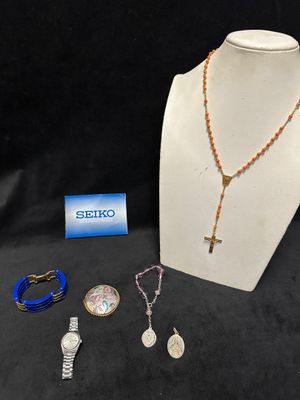 an assortment of jewelry including a necklace, bracelet, and ring
