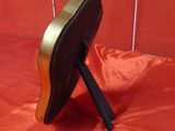 a black and gold folding chair on a red cloth