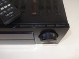 an image of a remote control on top of a dvd player