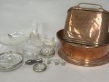 several pieces of glass and metal are sitting on a white surface
