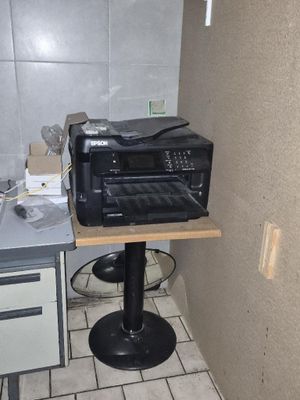 a toaster oven sitting on top of a table in a kitchen