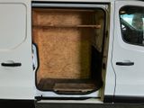 a white van with the door open on the side of the road