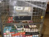a shopping cart with many items in it in a warehouse