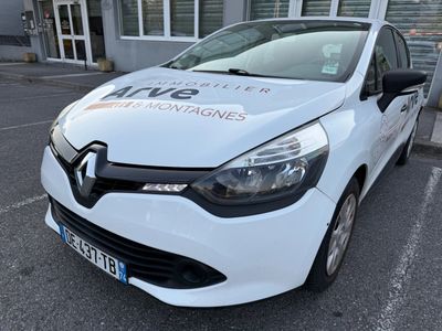 a white car that is parked in front of a building
