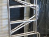 a metal ladder that is sitting in the middle of a room