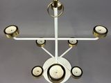 a chandelier that has five candles on it