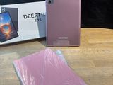 the phone is sitting on the table next to the box