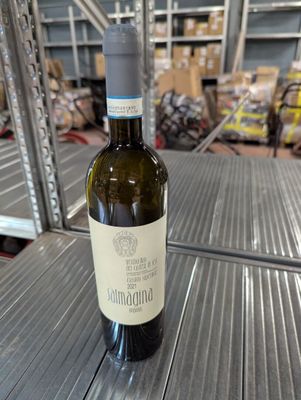 a bottle of wine that is sitting on a table