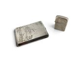 silver cigarette case and lighter on a white background