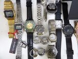 a lot of watches that are sitting on a table