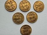 six gold sovereigns, one of which is a horse and the other of which is a horse
