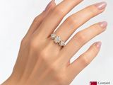 an image of a woman ' s hand with a diamond ring on it