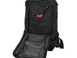 the back of a black backpack with a pen in it