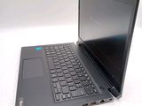 a laptop computer sitting on top of a white table