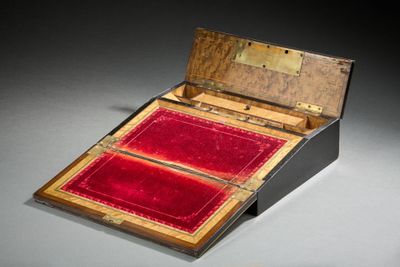 a small box with a red velvet lining inside of it