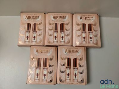 four boxes of airbrush airbrushs sitting on top of a table