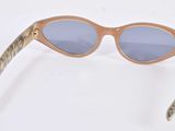 sunglasses on a white surface with a white background