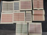 a table topped with lots of different types of stamps on top of each other