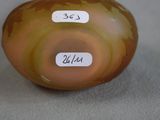 a picture of a glass vase with a label on it