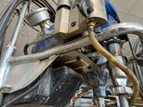an image of a machine that is working on a piece of metal