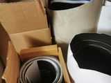 a person holding a cup in a box with other items