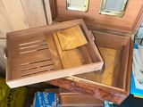 a pile of wooden boxes and other items on the floor