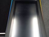 a tablet computer sitting on top of a table next to a laptop computer