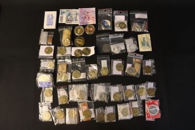 a lot of coins and other items on the table
