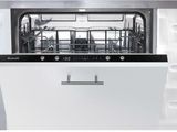 a close up of a dishwasher in a white kitchen