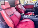 a red leather seat in the back of a car