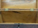 a wooden box that has a handle on it