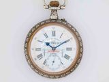 a pocket watch with roman numerals on the face