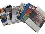 a lot of comic books on a white surface